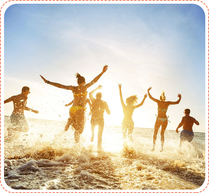 A group of people running in the sand.